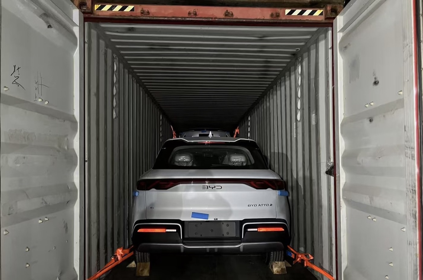 Vehicle chocked and lashed inside a 40-foot container before shipping
